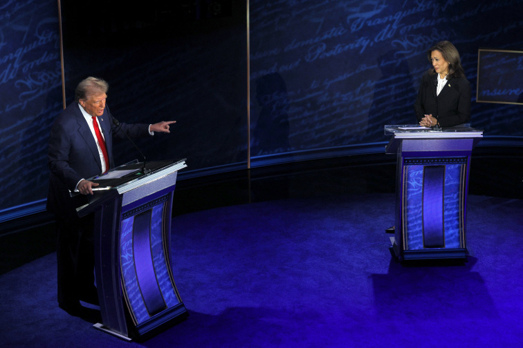 Caption/Description: Republican presidential nominee, former U.S. President Donald Trump points towards Democratic presidential nominee, U.S. Vice President Kamala Harris,during a presidential debate hosted by ABC in Philadelphia, Pennsylvania, U.S., September 10, 2024 REUTER