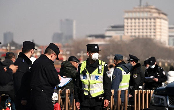 Beijing on High Alert: “Men in Black” Closely Monitor Delegates at the Two Sessions