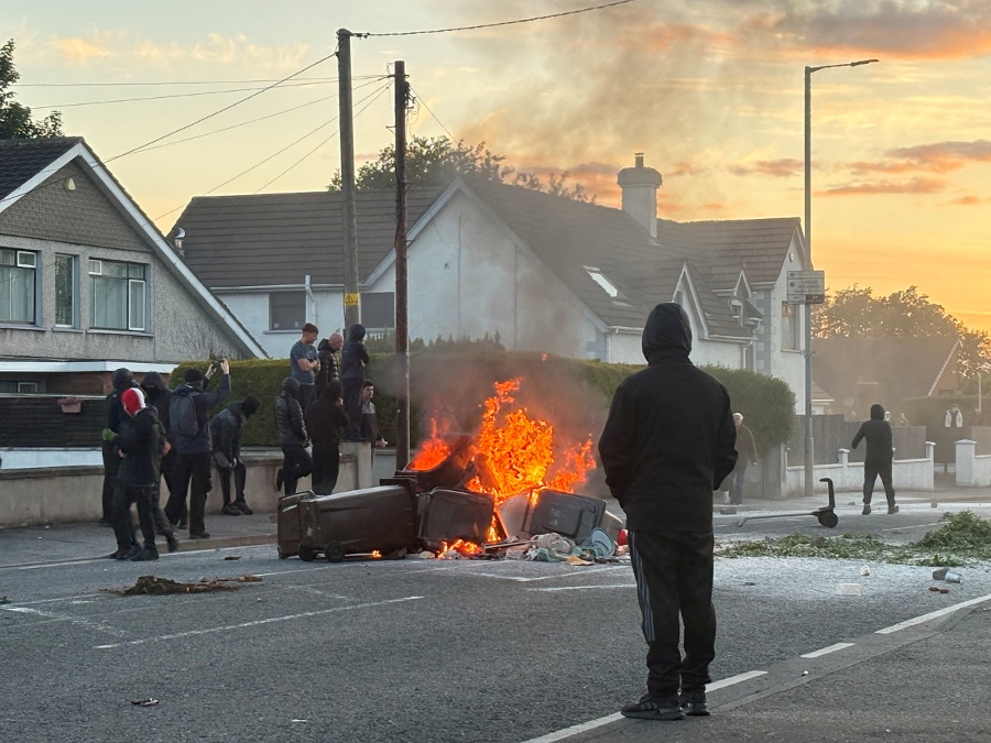 UK minister says violence in Northern Ireland is racist thuggery